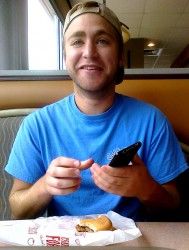 Taylor playing with his new Samsung Galaxy S2 Epic  phone at McDonalds